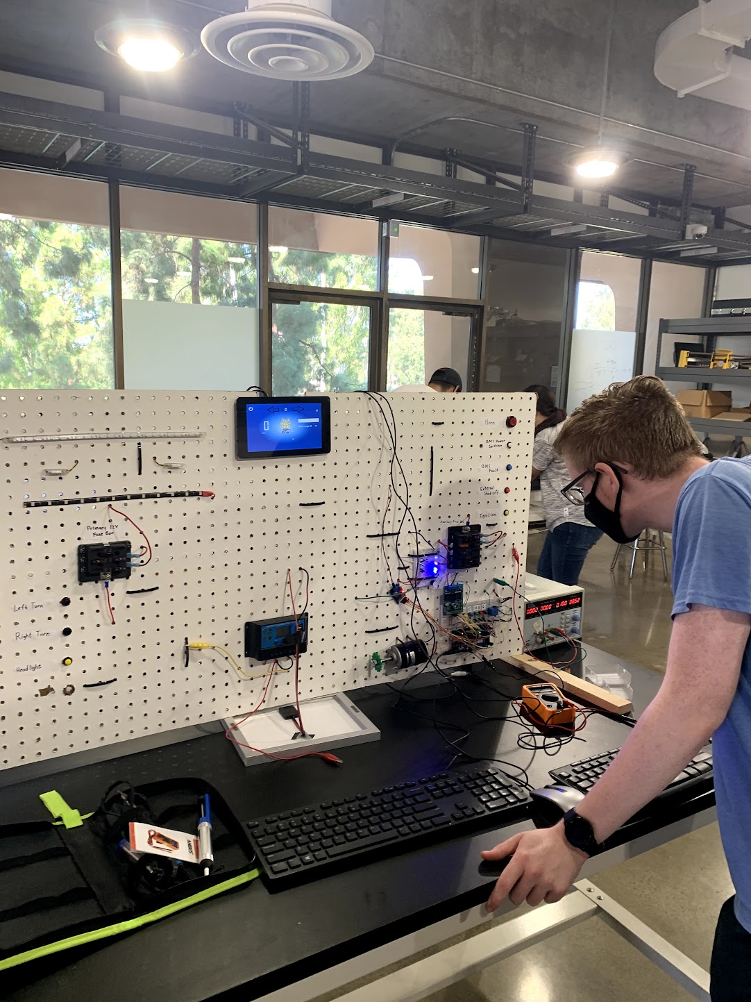Tanner reviewing the front of the pegboard